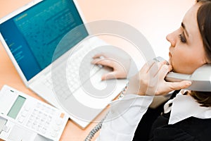 Woman working on laptop (focus on woman)