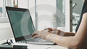 Woman working on laptop at home interier