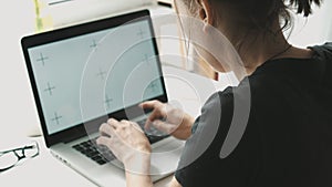 Woman working on laptop at home interier