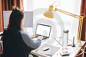 woman working on laptop at home. telework