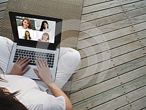 Woman working with laptop from home and VDO Call Conference to meeting business team photo