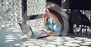 Woman Working on Laptop in Modern Office