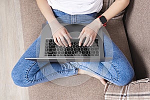 Woman working on the laptop in modern space. Top view. Home office or online education concept. impersonal concept photo