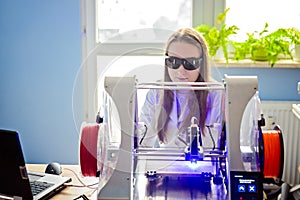 Woman working with laser engraver