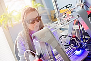 Woman working with laser engraver