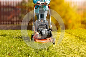 Woman working with a lawnmower
