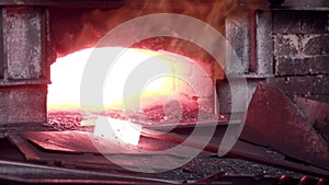 Woman working with Liquid molten metal melted in furnace at metallurgical plant.