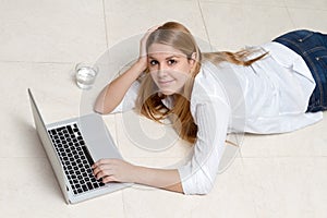 Woman working lying on floor