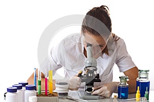 Woman working with a microscope