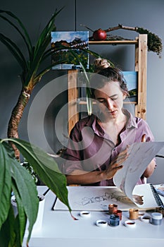 Woman working at modern work place in art studio