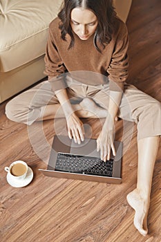 Woman working at notebook