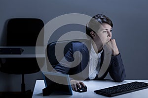 Woman working in office at night