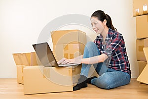 Woman working online during relocation