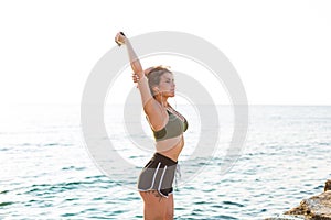 Woman working out at the beach