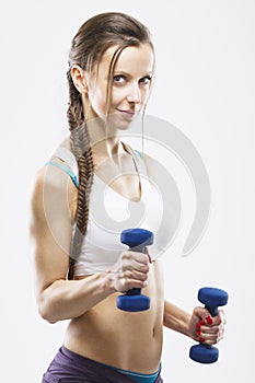 Woman working out with a dumbbell