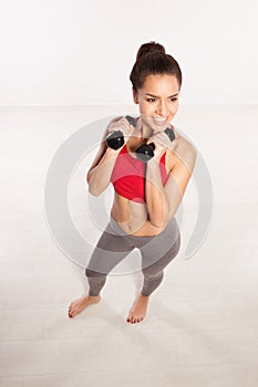 Woman working out with dumbbells