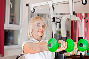 Woman working out with dumbbells