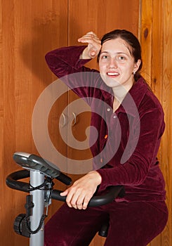 Woman working out on exercycle