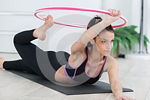 woman working out with hoola hoop