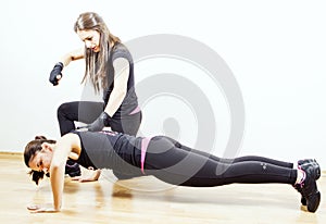 Woman working out with personal trainer