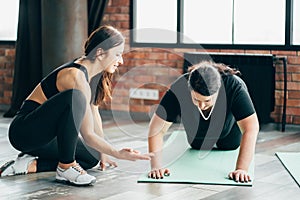 Woman working out with personal trainer support