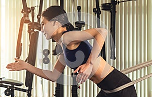 Woman working out with Resistance elastic in gym