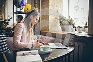 Woman working on planning project. copywriter freelancer using laptop computer, mobile phone and internet, working online,