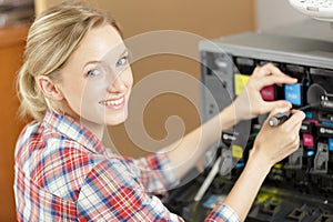 woman working with printer machine at office