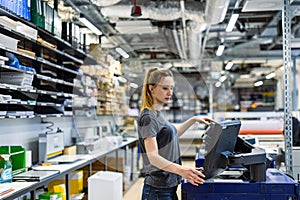 Woman working in a printing factory