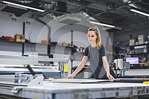 Woman working in a printing factory