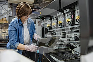 Woman working in a printing factory