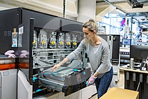 Woman working in a printing factory