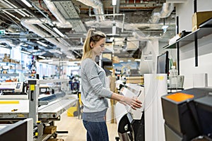 Woman working in a printing factory