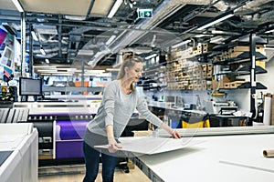 Woman working in a printing factory