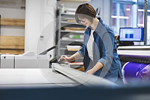 Woman working in a printing factory