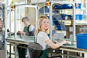 Woman working on production line