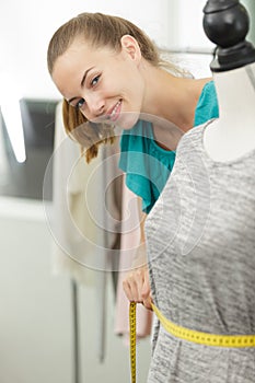 woman working with sketches in fashion design studio