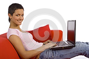 Woman working on the sofa