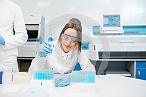 Woman working with test tubes in the laboratory