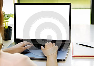 Woman working and tying on laptop computer with blank withe screen, Online internet marketing, laptop template