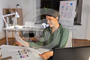 Woman working on user interface at night office