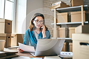 Woman is working at warehouse for online store