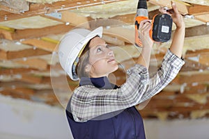 woman working with wooden structures and tools