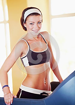 Woman, workout portrait and happy on treadmill for fitness, wellness and health in gym with excited face. Girl runner