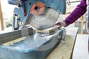 A woman works in a carpentry workshop