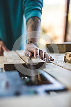 A woman works in a carpentry workshop