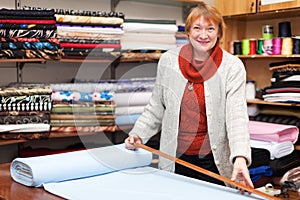 Woman works at fabric store