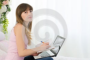 Woman works on a laptop