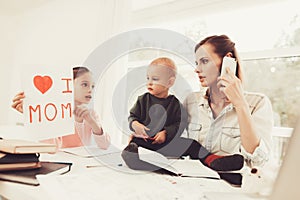 A Woman Works During Maternity Leave At Home.