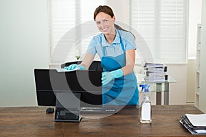 Woman In Workwear Rubbing Computer photo